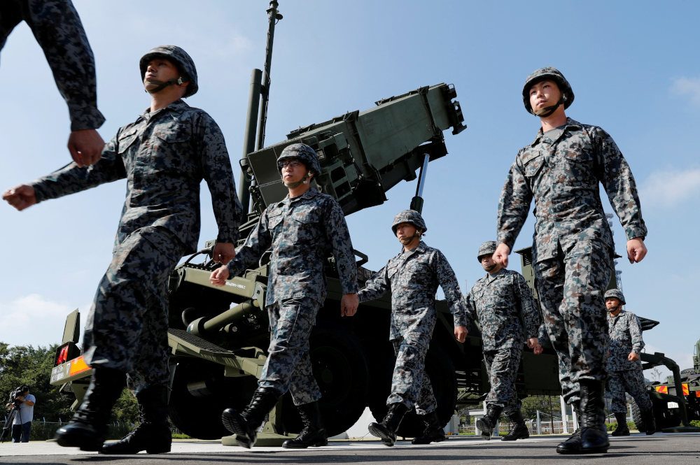 Japan puts missile defense on alert as North Korea warns of satellite launch