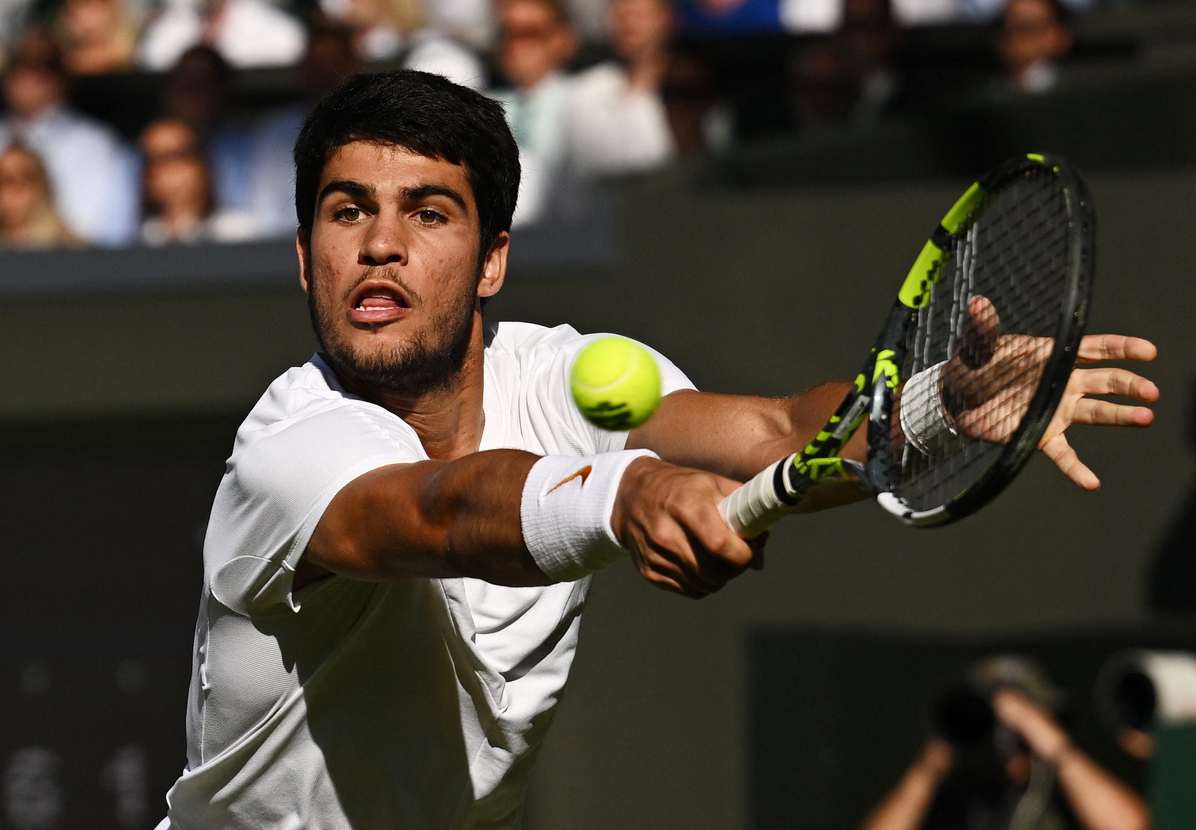 Alcaraz douses Rune fireworks to reach Wimbledon semis for first time