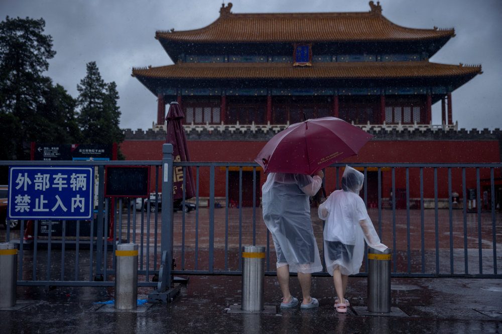 Extreme rain in Beijing after typhoon turns roads into rivers, kills 2