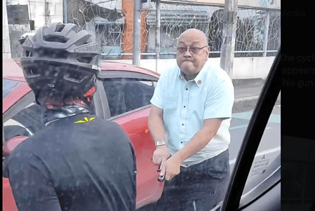 Quezon City vows to probe man who pulled gun on cyclist