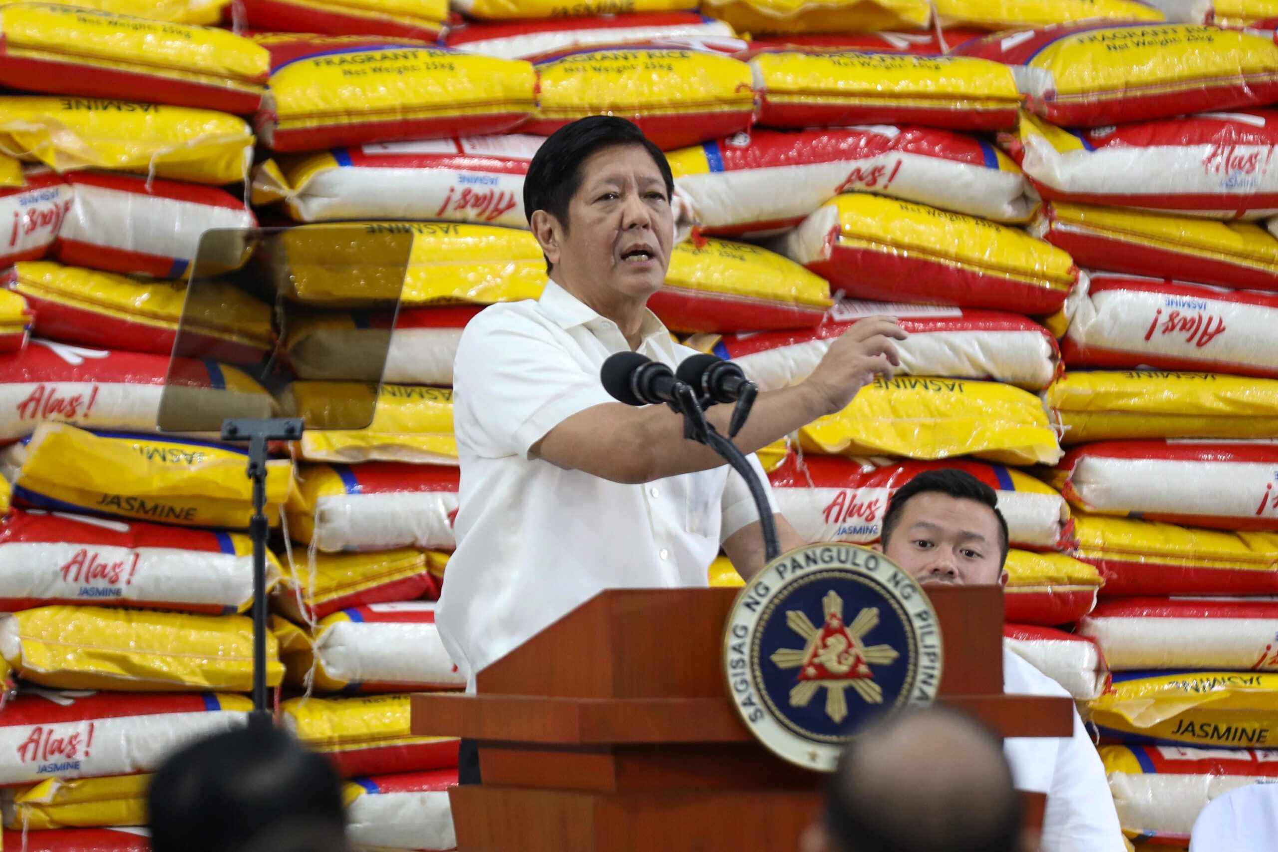 Marcos lifts price cap on rice