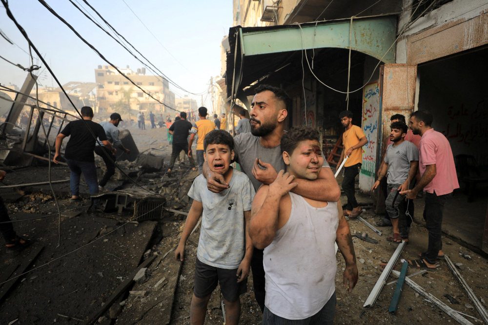 Israel bombards Gaza, prepares invasion as Biden urges path to 2 states