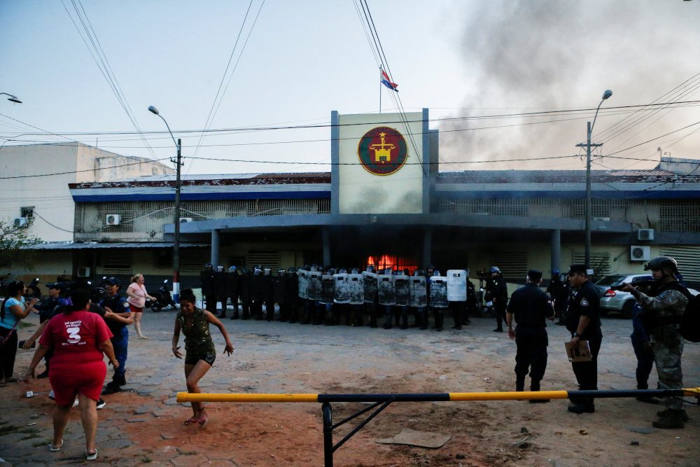 Paraguay’s biggest prison set ablaze, rioting inmates take guards hostage
