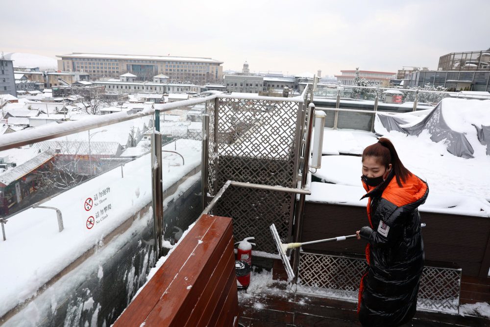 Week’s second cold wave encases China’s Beijing in snow, ice