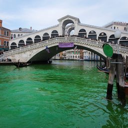 Italian climate change protesters turn Venice’s Grand Canal green