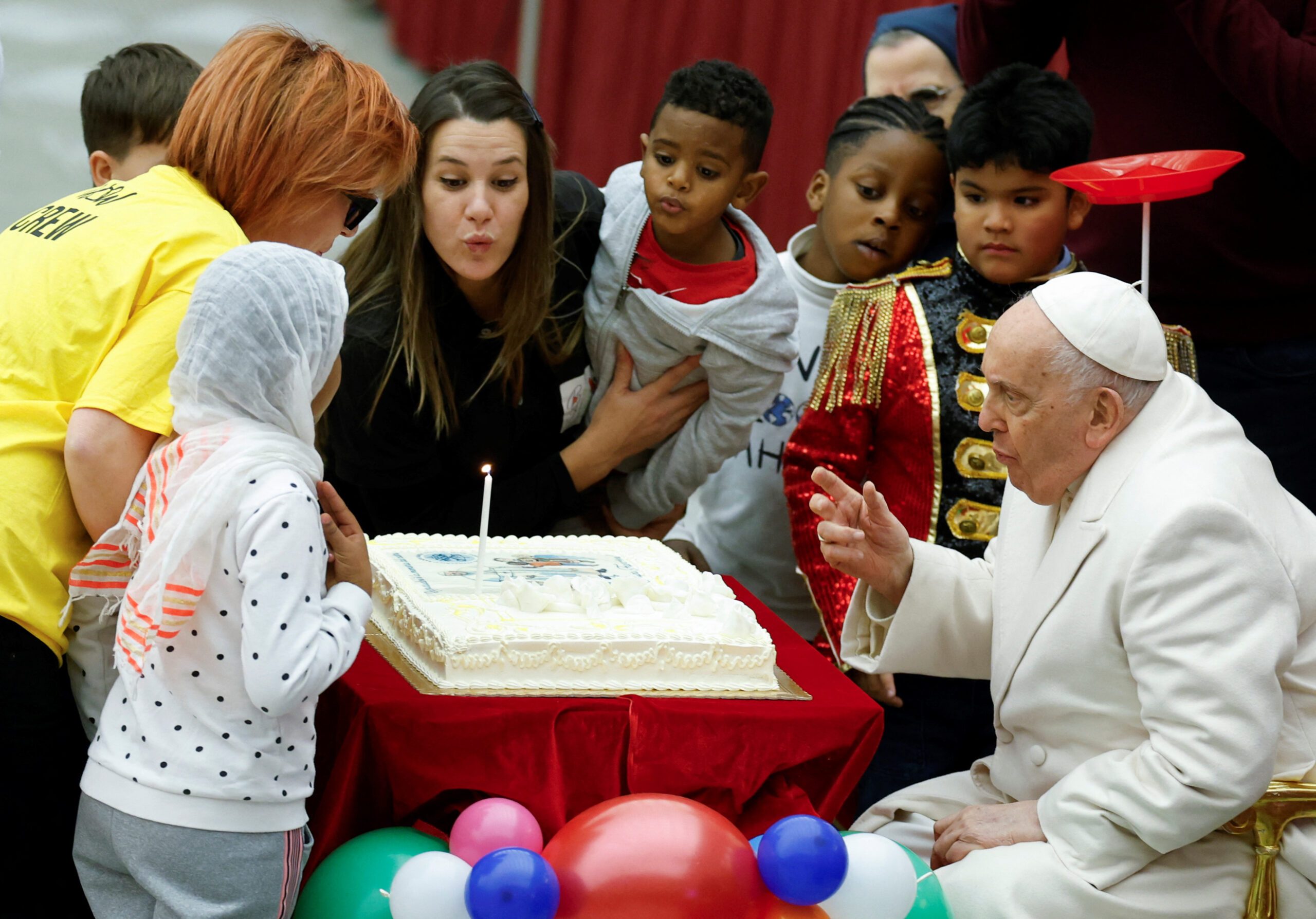 Children help Pope Francis mark 87th birthday