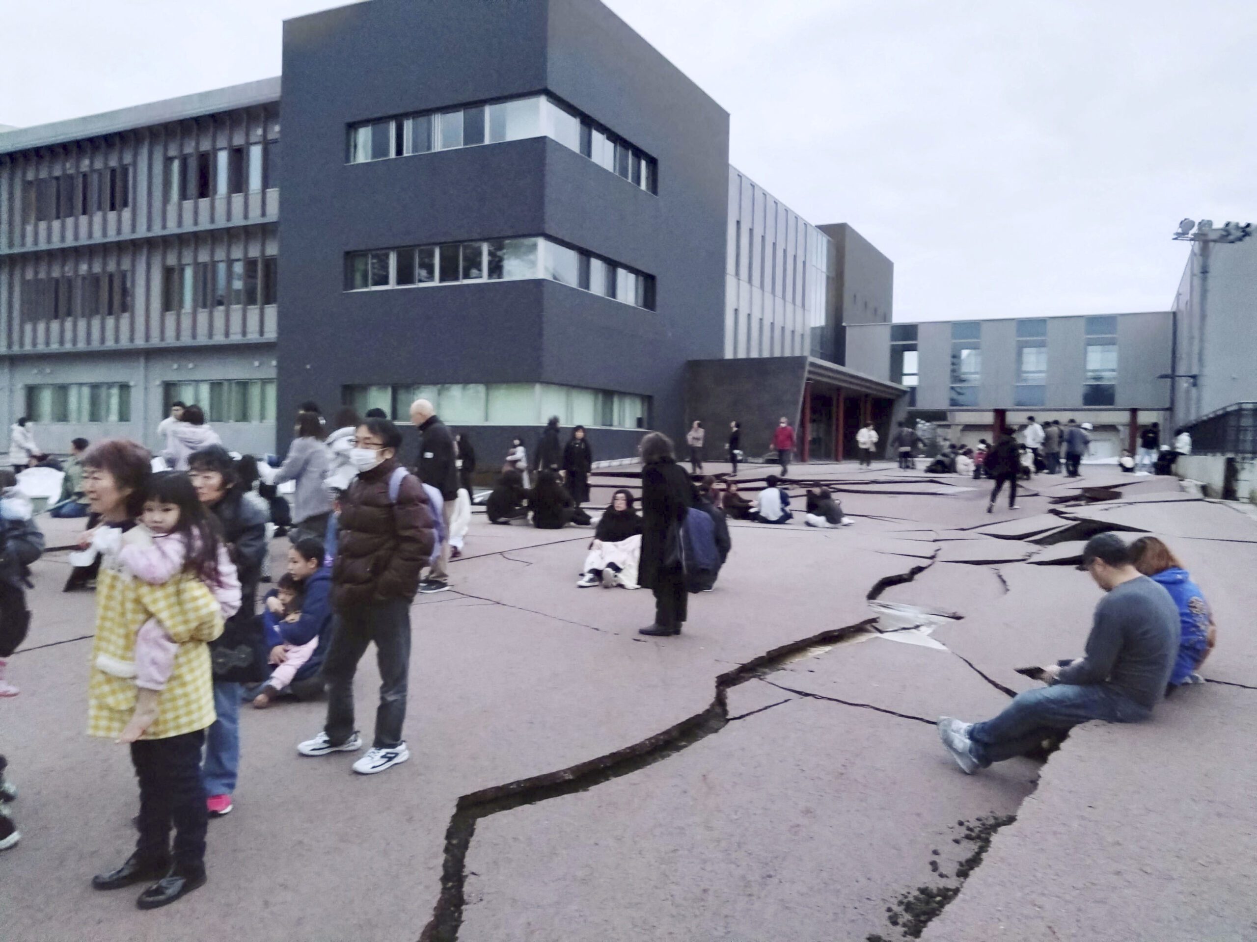 Japan earthquake: Survivors face freezing rain, threat of landslides