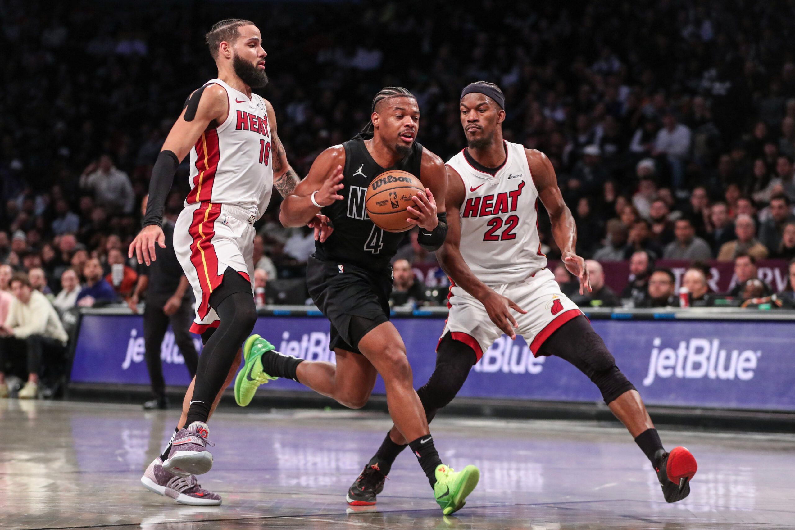 Jimmy Butler returns from 7-game absence, guides Heat past Nets in overtime thriller
