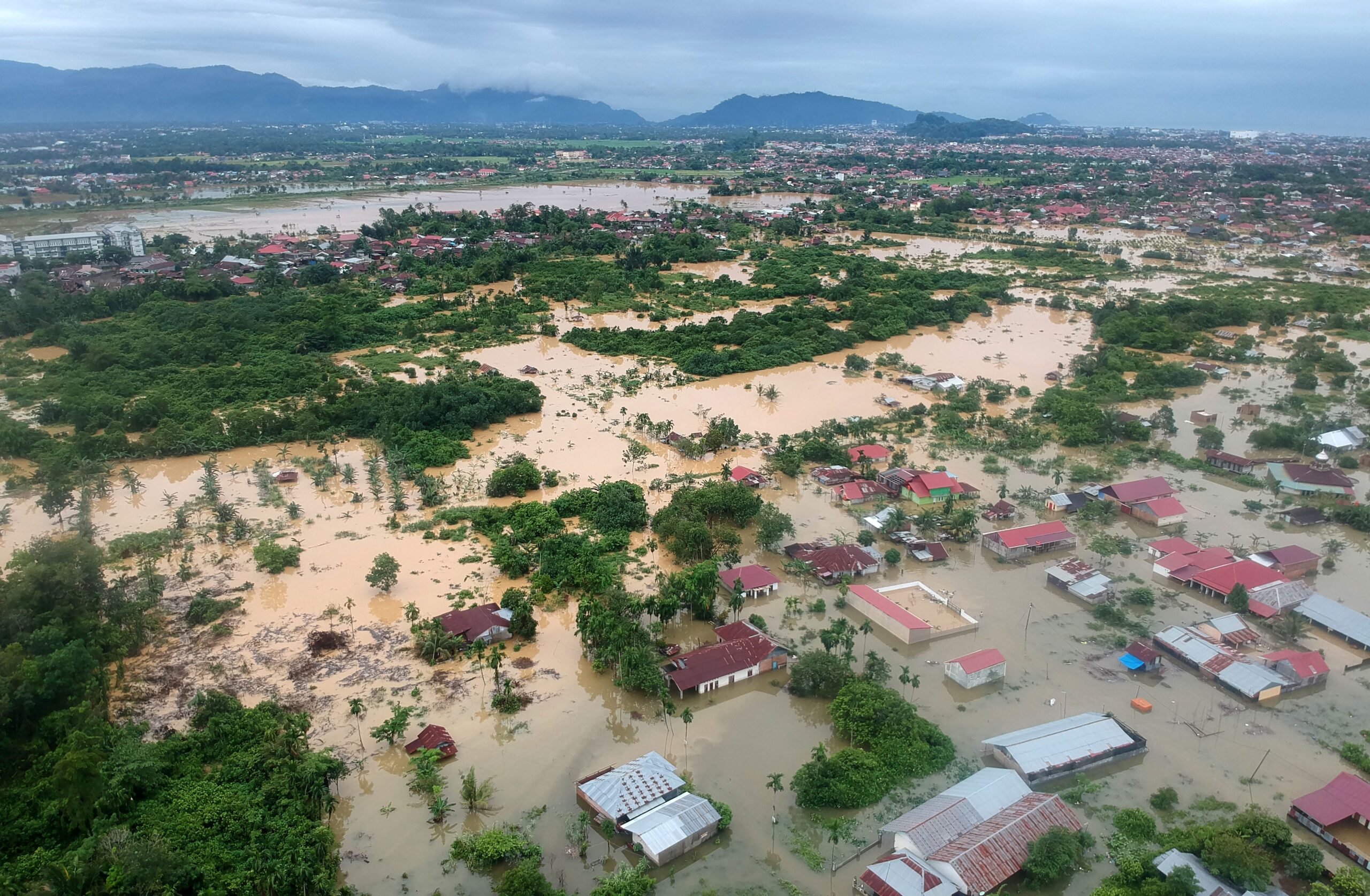 Indonesia floods, landslide kill 19, with 7 missing