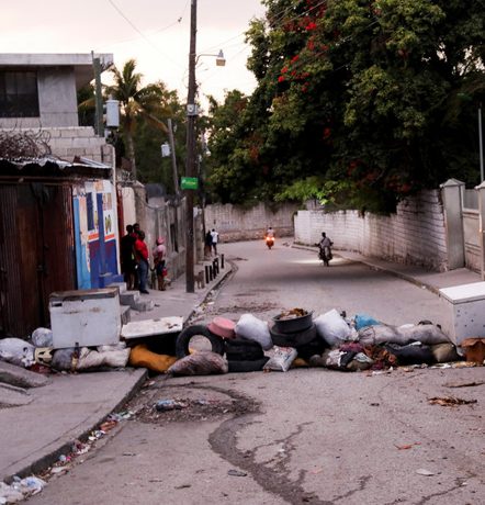 Suspected Haiti gang members set on fire as conflict spreads to capital suburb
