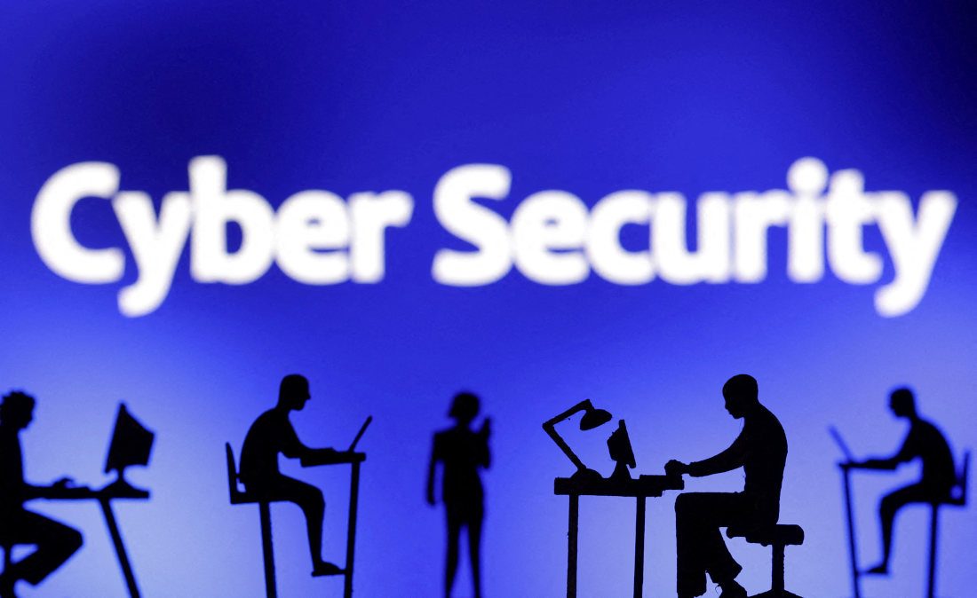  						CYBERSECURITY. Figurines with computers and smartphones are seen in front of the words 'Cyber Security' in this illustration taken, F