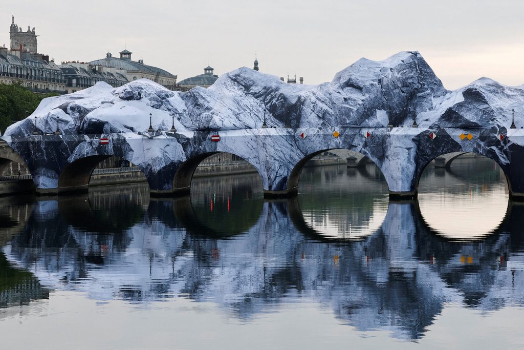 The temporary artwork "La Caverne du Pont Neuf" (The Pont Neuf Cave) conceived by French street artist JR as a tribute to Christo et Jeanne-Claude is revealed to the public after being inflated overnight on the Pont Neuf bridge, in Paris
