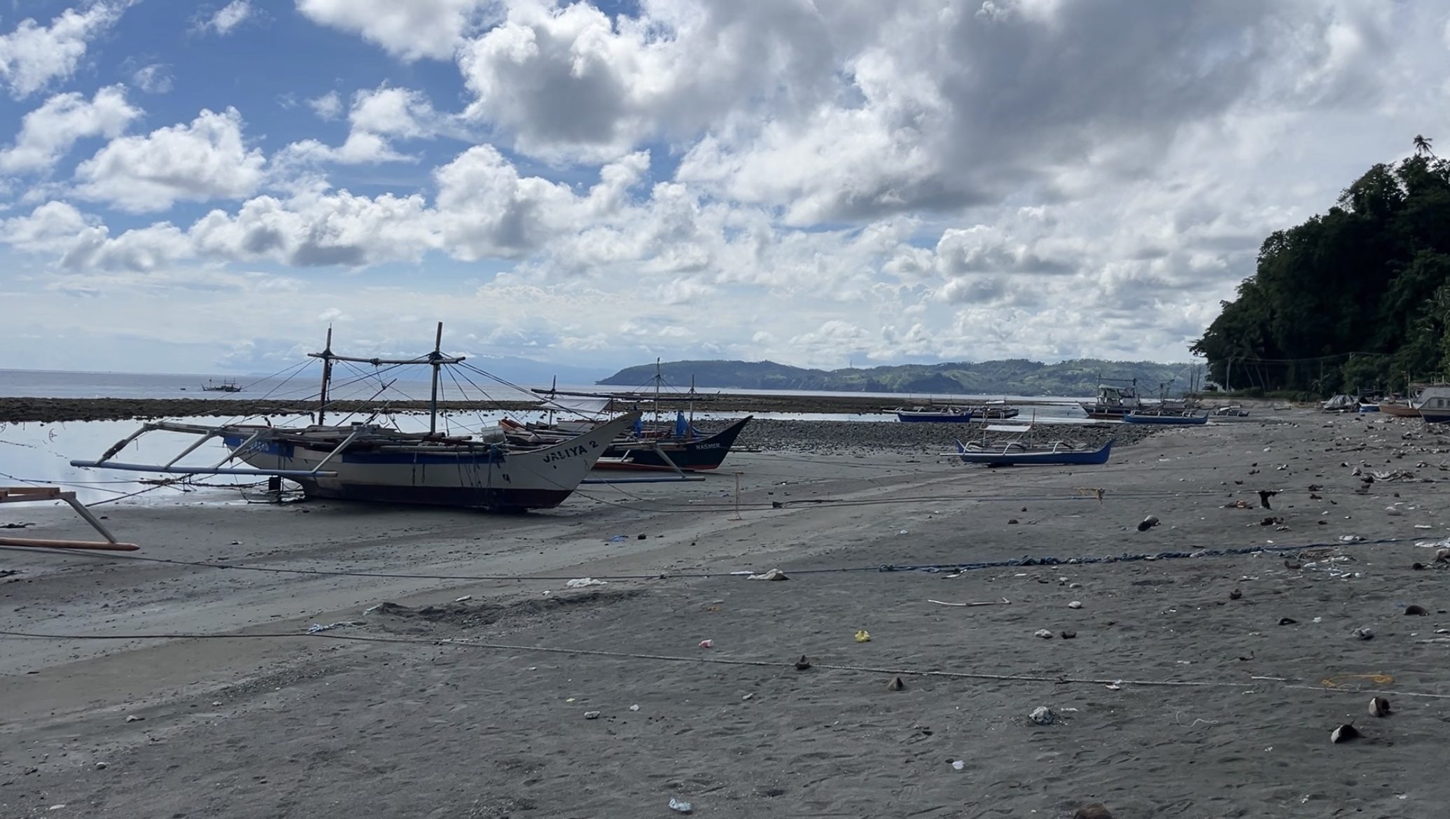 How does coastal uplift affect livelihood in Glan, Sarangani?