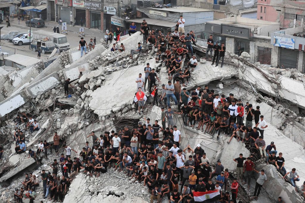 Palestinians watch the FIFA World Cup 2026 Round of 16 match between Argentina and Egypt, in Gaza City