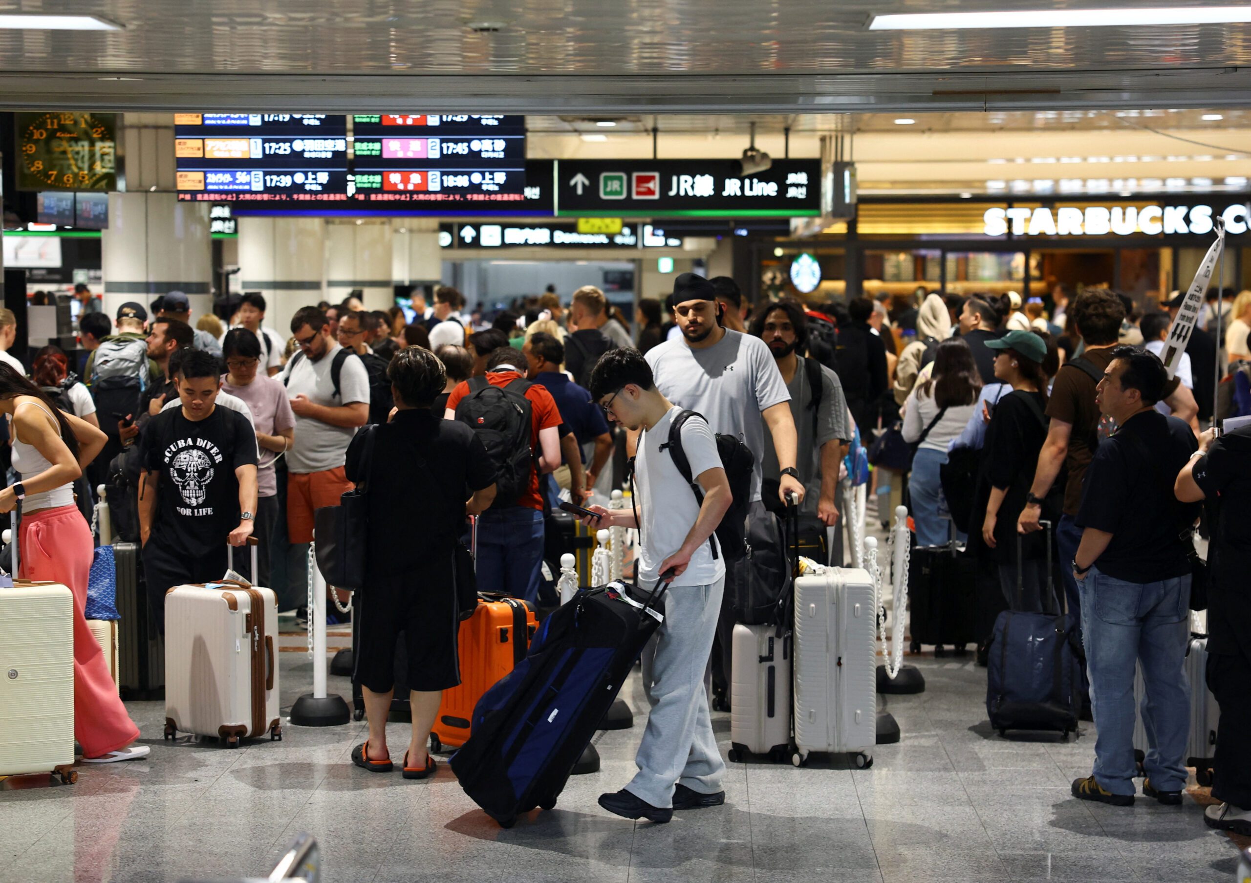 Japan’s record rains strand thousands at Narita airport, kill eight