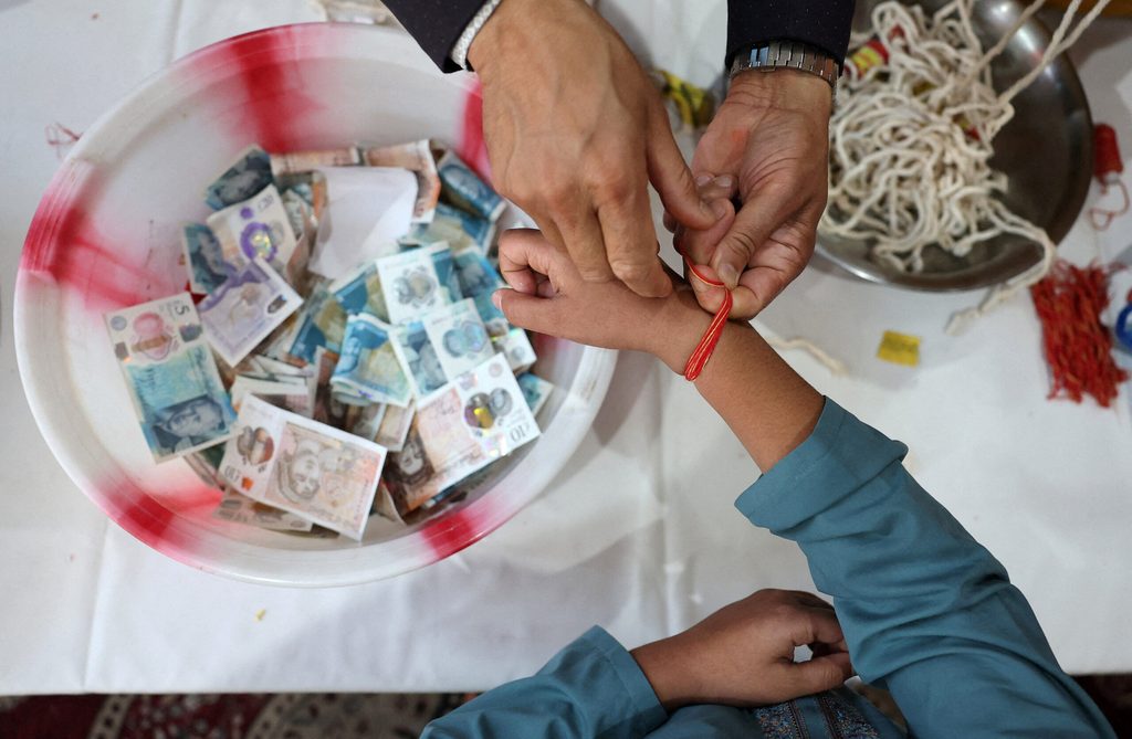 Donations to support relief effort for victims of the flash floods and mudslide that struck Nepal on August 26, at Shree Pashupatinath Temple in London