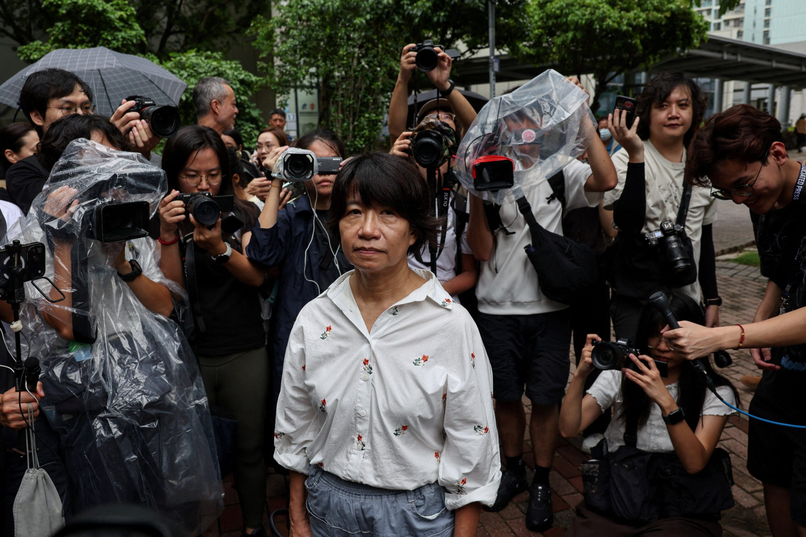 Elizabeth Tang Yin-ngor, wife of former Hong Kong Alliance leader Lee Cheuk-yan, leaves West Kowloon Magistrates' Courts following the conviction of three former Tiananmen vigil organizers charged with inciting subversion of state power, in Hong Kong