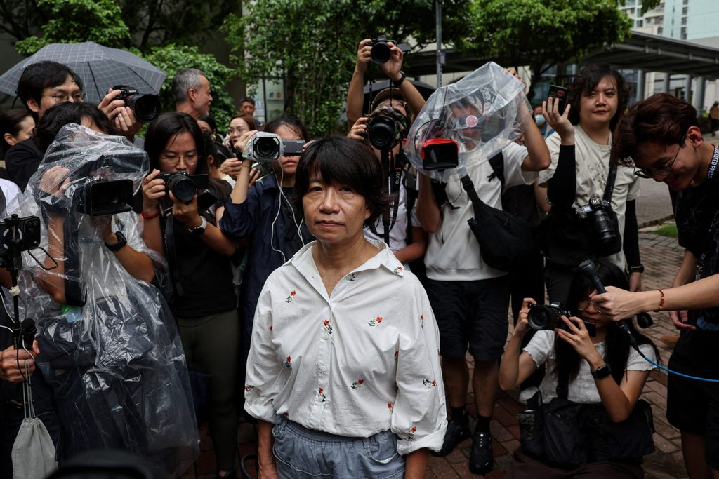 Elizabeth Tang Yin-ngor, wife of former Hong Kong Alliance leader Lee Cheuk-yan, leaves West Kowloon Magistrates' Courts following the conviction of three former Tiananmen vigil organizers charged with inciting subversion of state power, in Hong Kong
