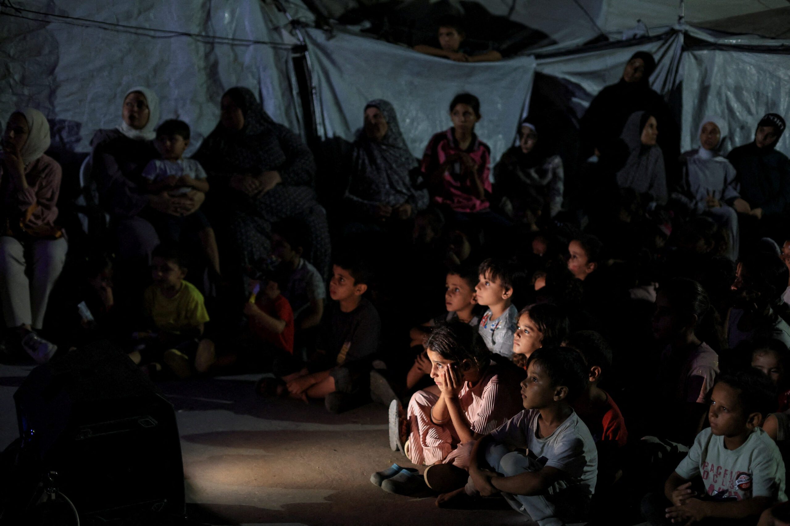 Palestinian children attend mobile cinema screening in Gaza City