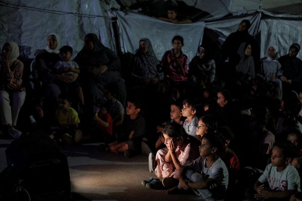 Palestinian children attend mobile cinema screening in Gaza City