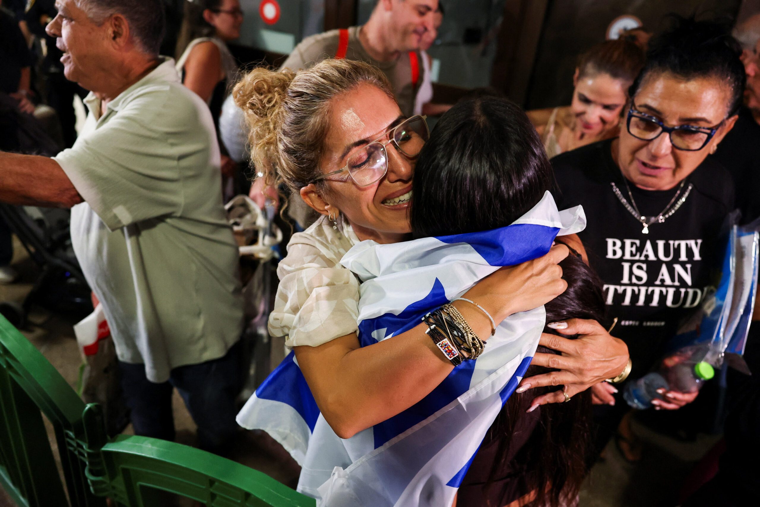 Passengers from a FlyDubai flight to Israel from United Arab Emirates that was diverted to Saudi Arabia after an emergency signal arrive at Ben Gurion International Airport