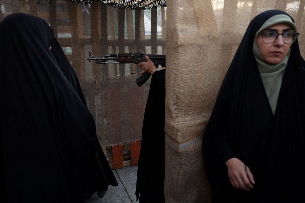 Iranian women volunteers receive military training at a military training center for ordinary citizens at Imam Hussein Square in central Tehran