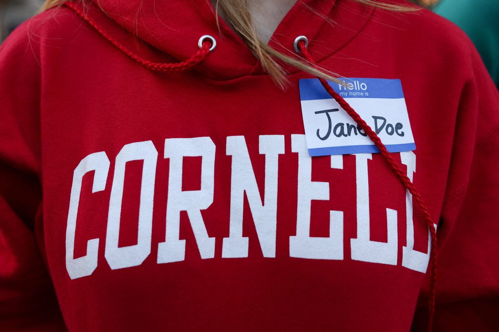 People attend a Justice for Survivors rally on at Cornell University in Ithaca, New York