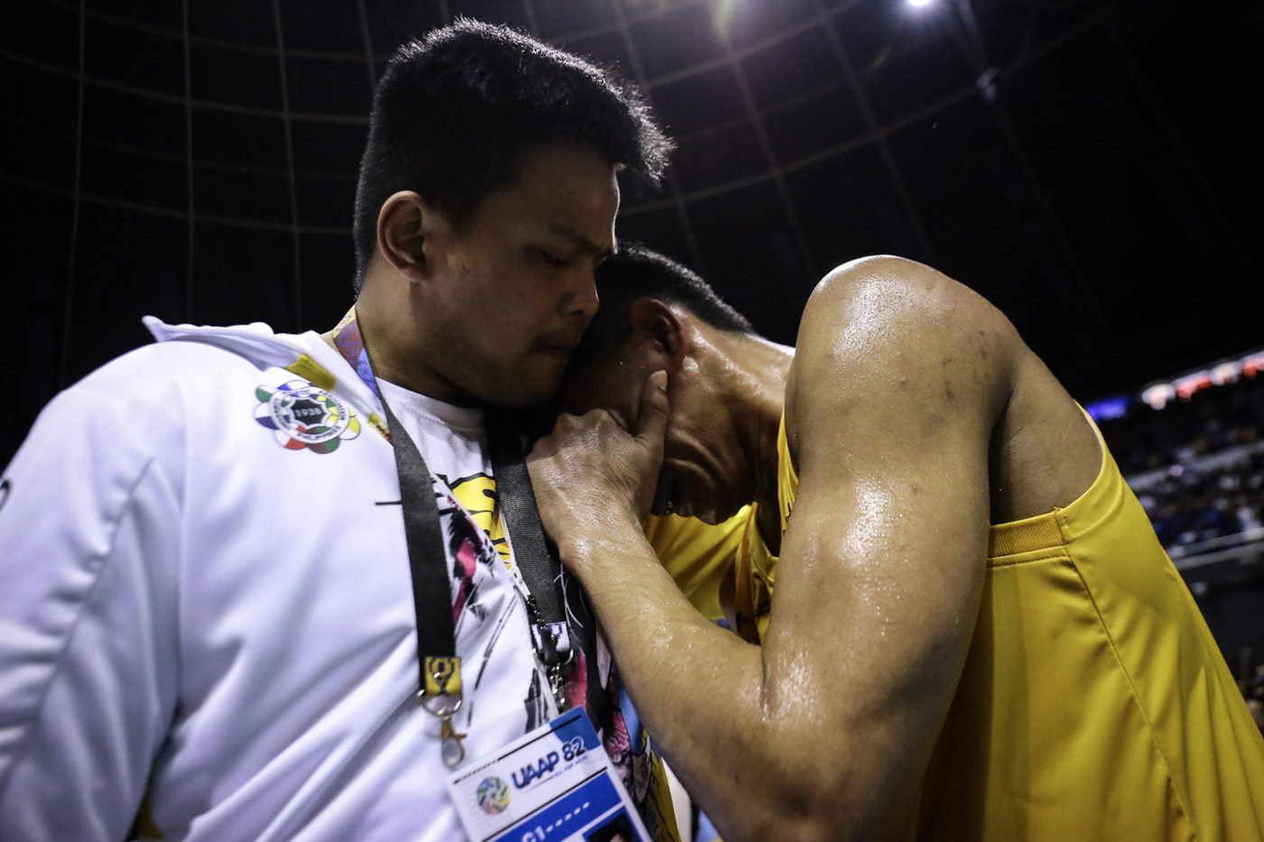 WASTED EFFORT. The Tigers console a devastated rookie Mark Nonoy, whose team-high 26 points goes down the drain. Photo by Josh Albelda/Rappler  