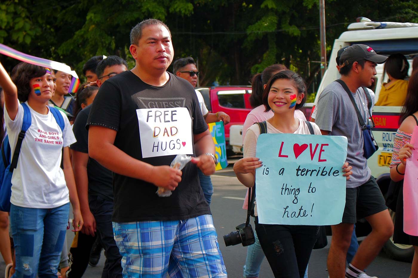 FATHERLY PRIDE. Clint Severino and daughter march side by side at Bacolod City's pride parade. Photo by Nichol Francis Anduyan 