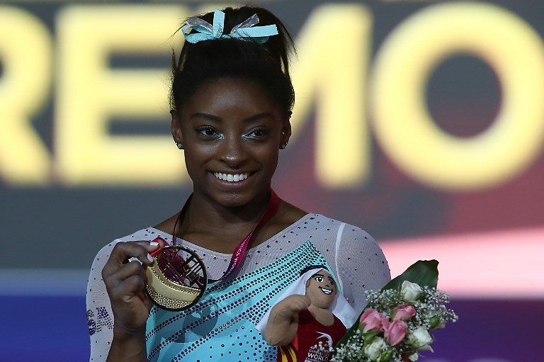 Unstoppable Biles claims record 4th all around world title