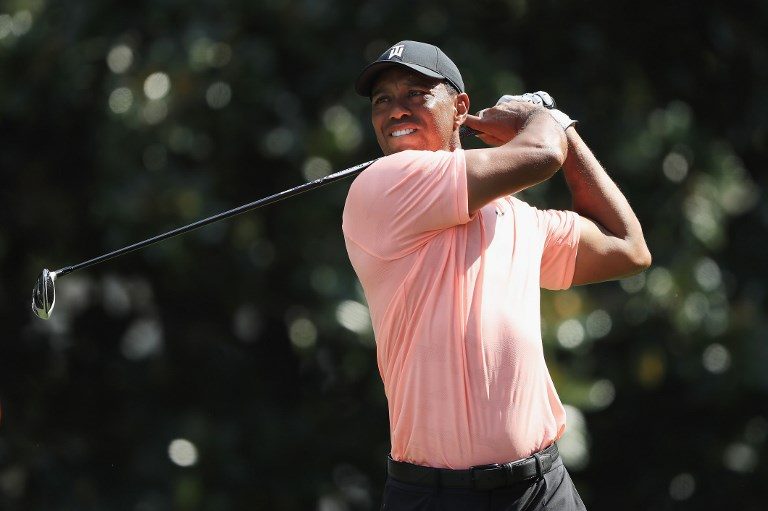 Tiger Woods seizes share of early lead at Tour Championship