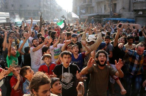 'GOOD NEWS.' Syrian gather in a street in Aleppo on August 6, 2016, to celebrate. Photo by Thaer Mohammed/AFP 