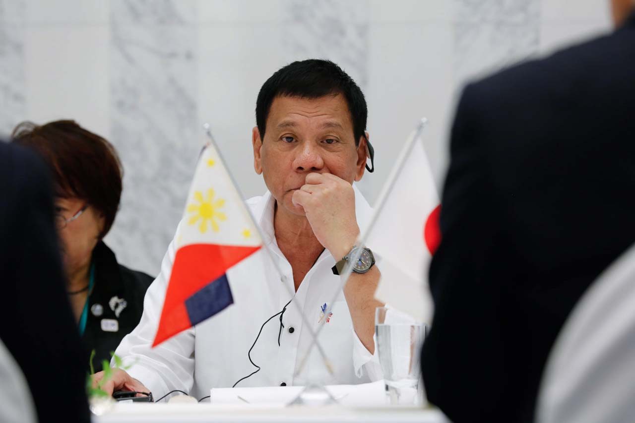 Gum-chewing Duterte challenges protocol in China, Japan trips