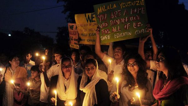 FOR MALALA. Pakistani civil society activists carry candles to pay tribute to gunshot victim Malala Yousafzai and protest against her assassination attempt, in Lahore on October 10, 2012. AFP PHOTO/ Arif Ali
