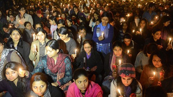 Indian protestors hold candles during a rally in New Delhi on December 29, 2012, after the death of a gang rape student from the Indian capital. Indian leaders appealled for calm fearing fresh outbursts of protests after the death of a gang-rape student victim. New Delhi's top police officer and chief minister have urged people to mourn the death of a gang-rape victim in a peaceful manner as large parts of the city-centre were sealed off. The calls for calm came after an Indian woman who was gang-raped on a New Delhi bus died in a Singapore hospital after suffering severe organ failure. AFP PHOTO/RAVEENDRAN