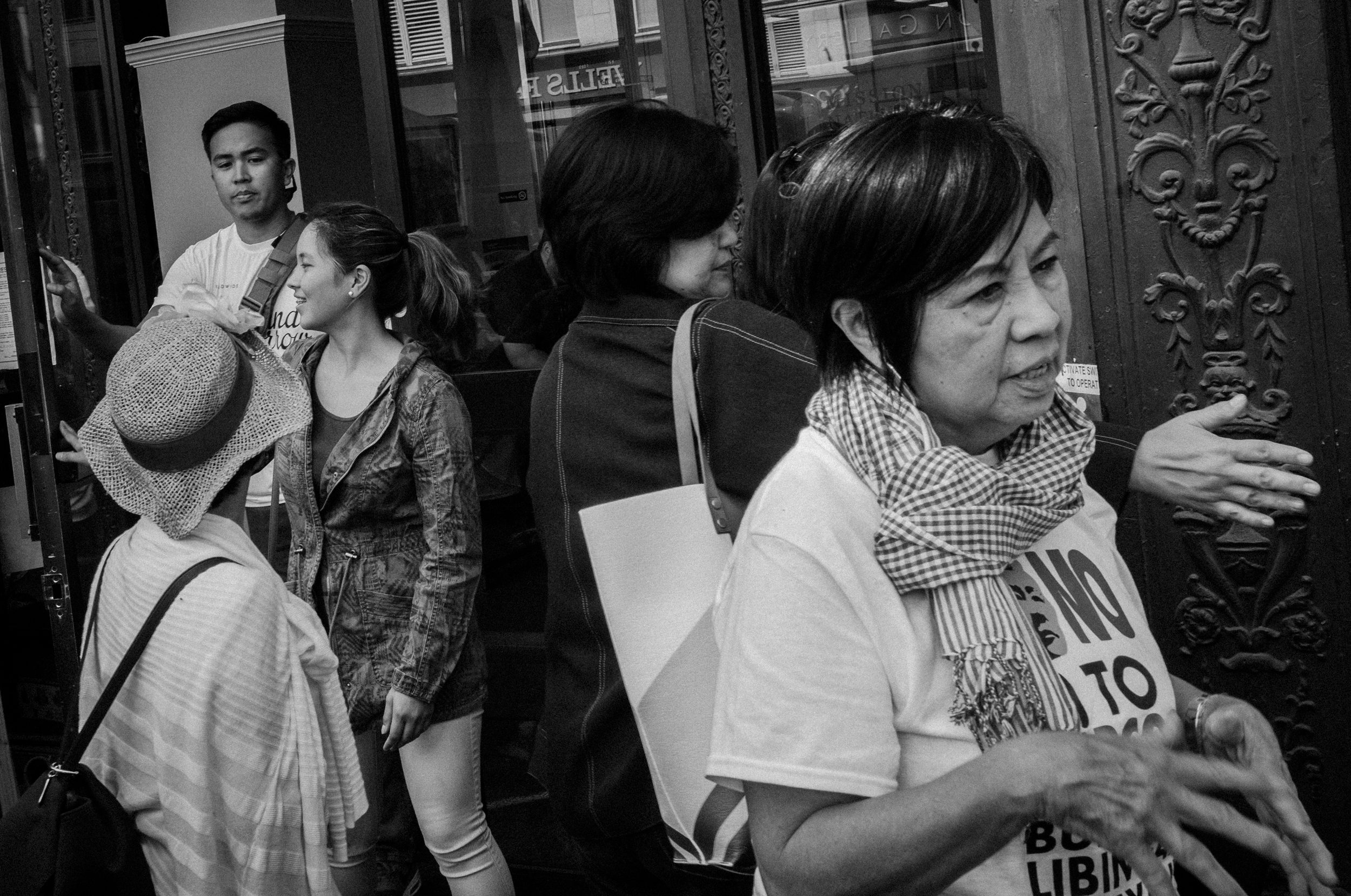 WOMEN VS MARCOS. Mila de Guzman, author of Women Against Marcos: Stories of Filipino and Filipino American Women who Fought a Dictator, at the demonstration. Photo by Rick Rocamora   