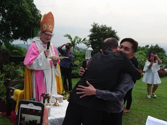 SAME-SEX WEDDING. Father Richard Mickley administers a same-sex couple's wedding. Photo courtesy of Father Richard Mickley   