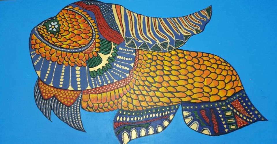 âLEARN TO FISH.â 23-year-old artist with autism Julyan Harrison uses bold colors and, living by the sea, likes drawing and painting sea objects. Photo courtesy of Rachel Harrison 