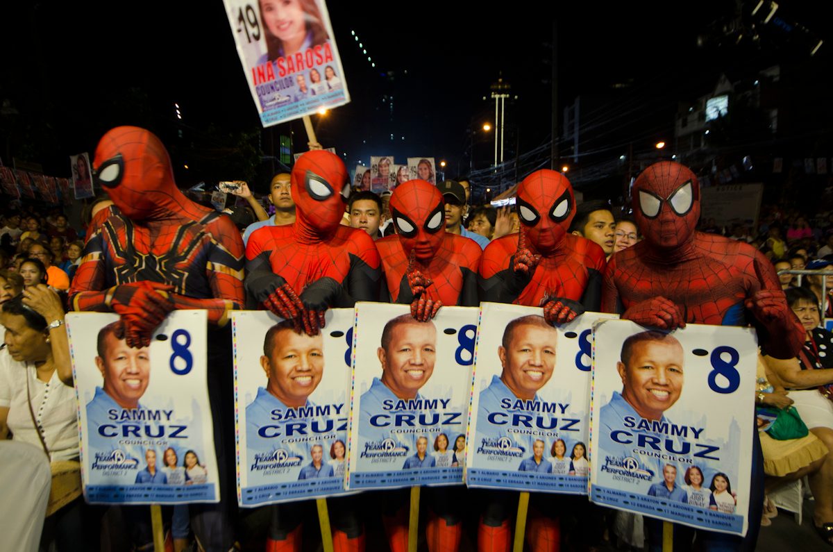 AVID FANS. Supporters of Abby Binay's city council bet Sammy Cruz are dressed like Spiderman. Photo by Rob Reyes/Rappler  