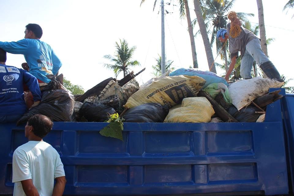TRASH HAUL. A garbage truck is filled with trash gathered by volunteers.  