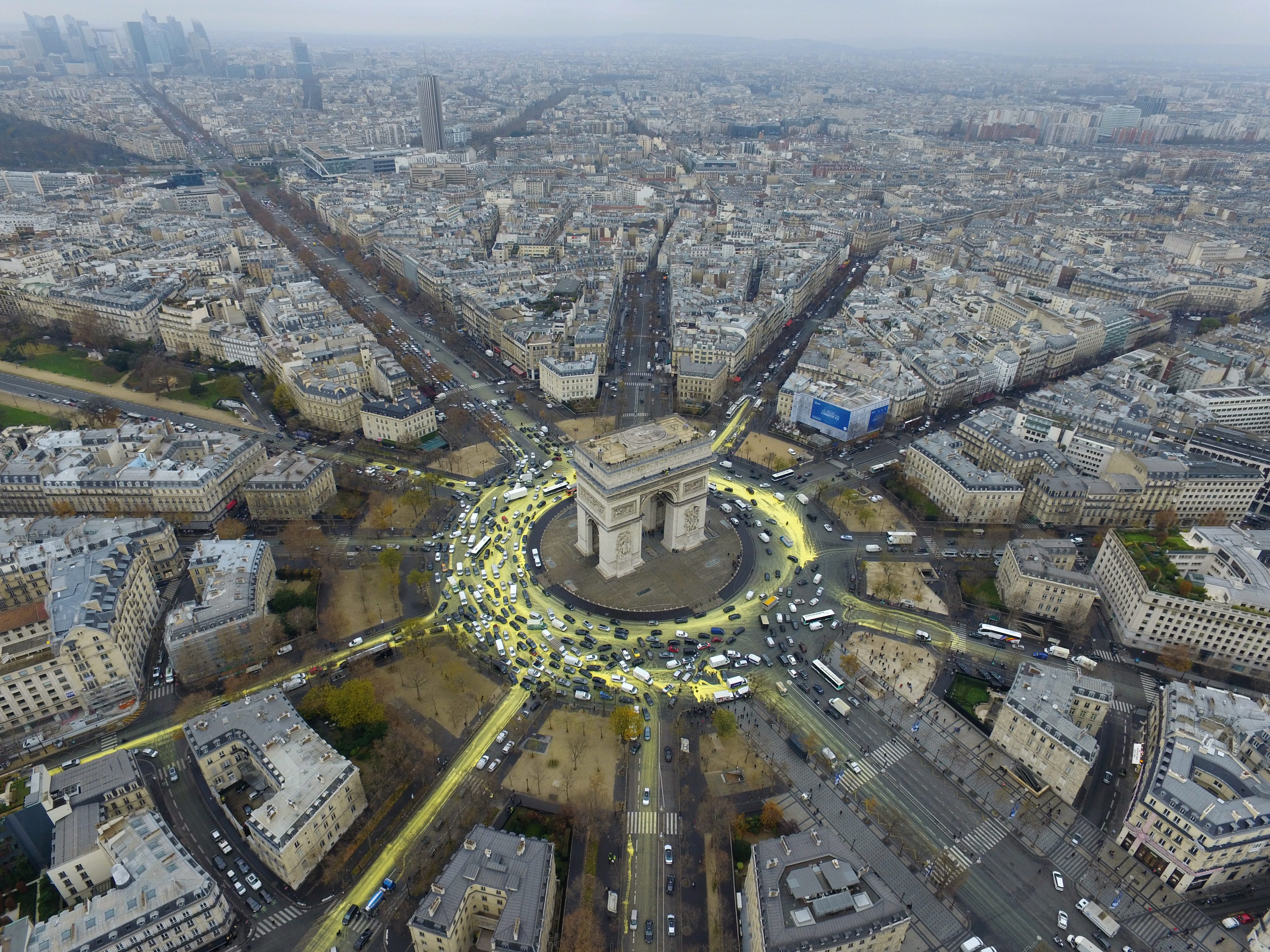 TRIUMPH? A handout picture provided by the environment protection organization 'Greenpeace' on 11 December 2015 shows an aerial view of a Greenpeace protest at the Place de L'Etoile during the COP21 World Climate Change Conference 2015, in Paris, France, 11 December 2015. About 50 activits tried to draw a yellow sun around the landmark 'Arc de Triomphe' monument. Launched by a historic gathering of world leaders, seen at mid-point as bringing the world closer than ever to a global deal, the COP21 climate summit has at times seemed nothing short of auspicious. EPA/GREENPEACE  