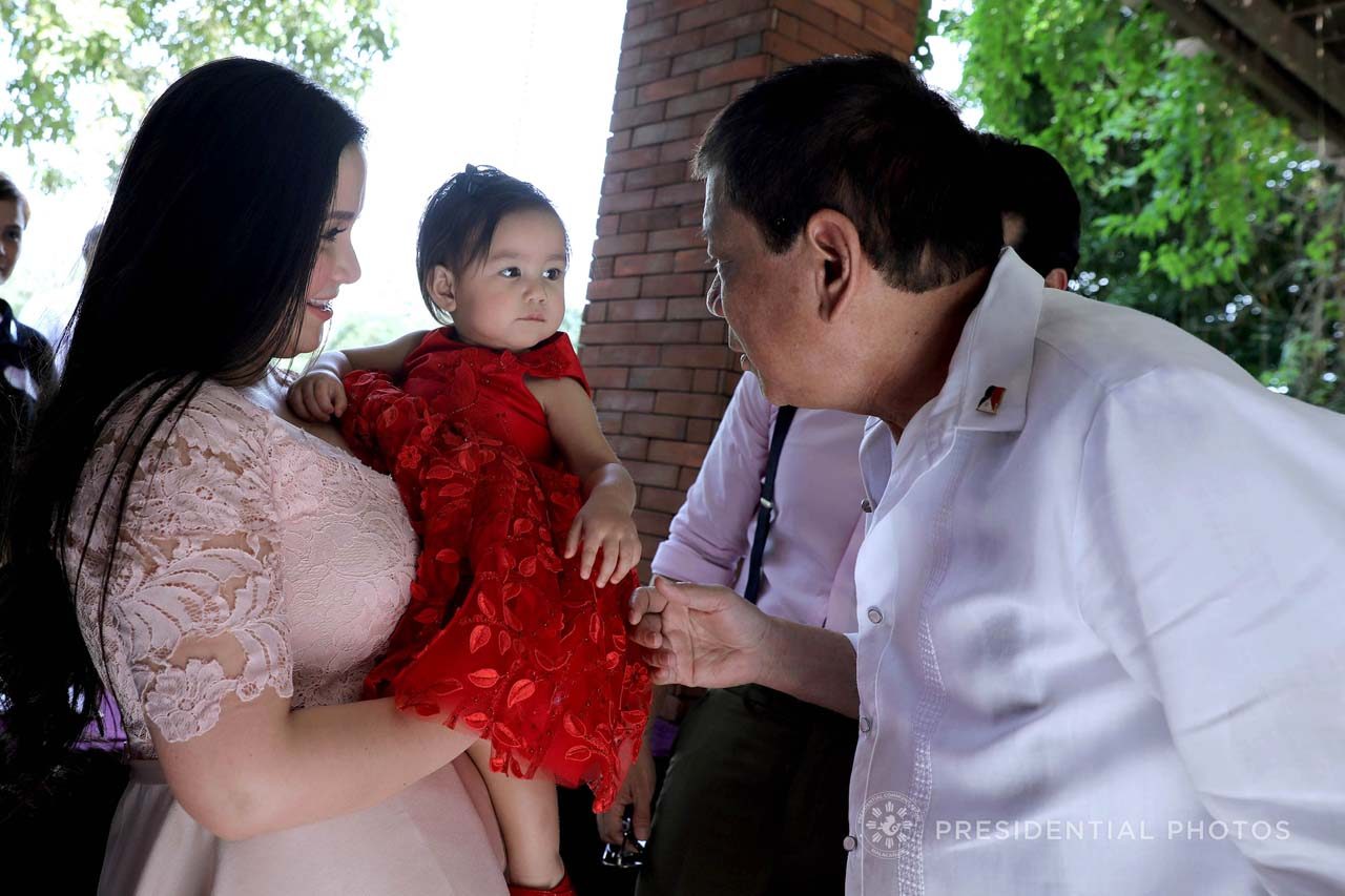 CELEBRATION IN MALACANANG. Mariel Rodriguez Padilla holds Maria Isabella as President Duterte meets her at the entrance of Malago. Malacañang photo 