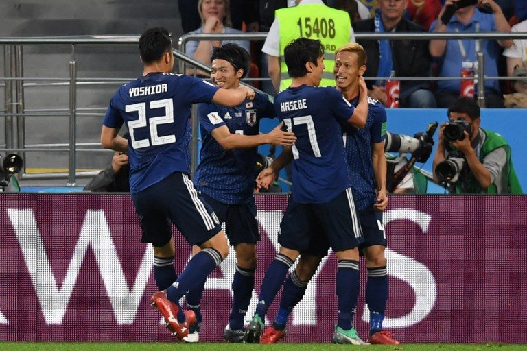 Japan defies doubters to home in on World Cup last 16