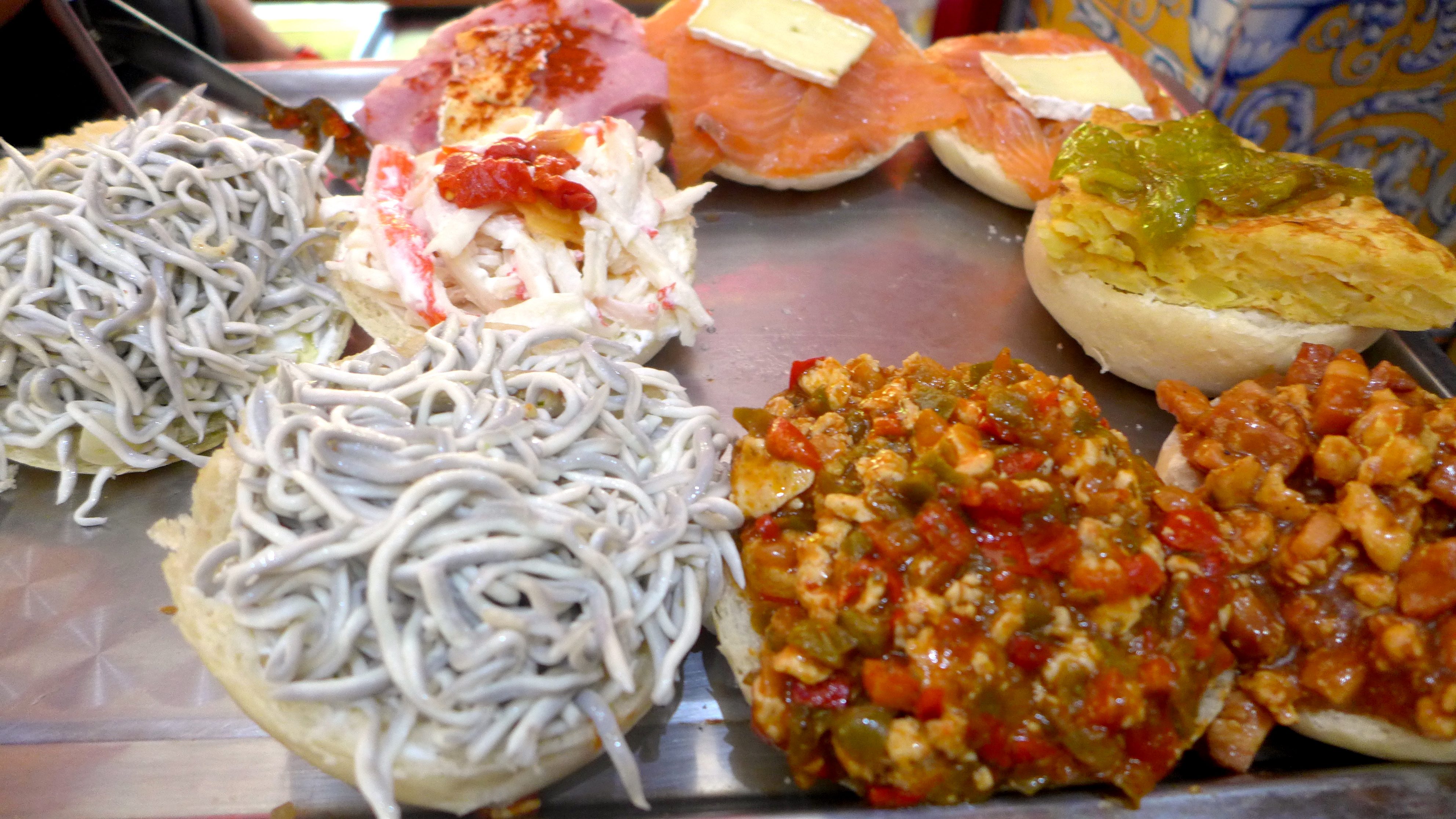 Angulas, tortilla, salmon, peppers, various Rastro tapas 