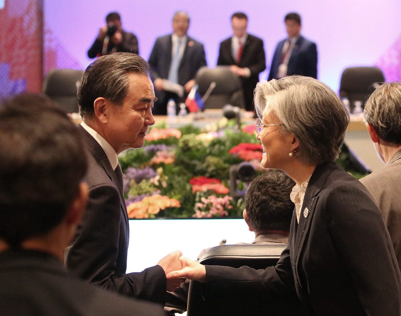 BIG NAMES. South Korean Foreign Minister Kang Kyung-wha (right) chats with Chinese Foreign Minister Wang Yi (left) during an ASEAN-related meeting in Manila. Photo by ASEAN Media Pool 