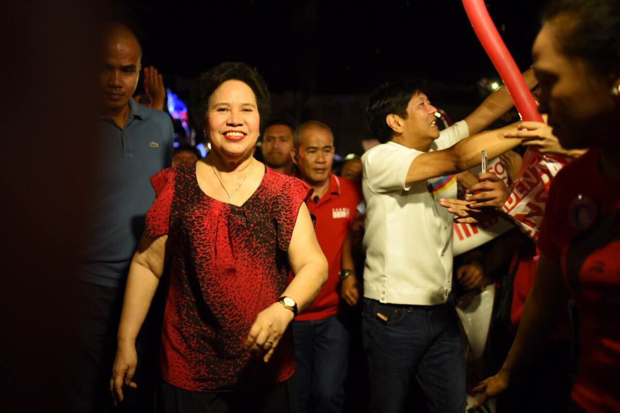 ENTOURAGE. Miriam Defensor Santiago and running mate Ferdinand Marcos Jr arrive for a street party along West Avenue, Quezon City. Photo by Martin San Diego/Rappler 