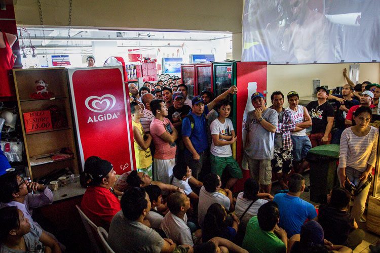 Disappointed Filipinos inside a Philippine supermarket in Dubai, UAE after the winner of the #MayPac bout was announced. Photo by Maureen Santos  