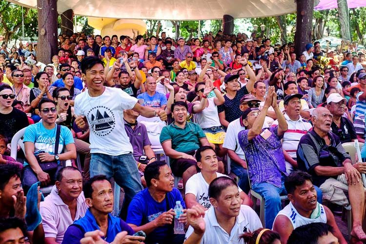 Crowd reacts as they watched Manny Paquiao connects his punches against Floyd Mayweather at the Misamis Oriental Capitol Ground In Cagayan de Oro City. Photo by Bobby Lagsa/Rappler 