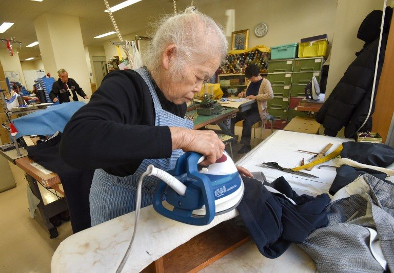 PENSION NOT ENOUGH. Workers repair clothes at a seniors' work center in Tokyo, Japan, on December 18, 2015. Photo by Toru Yamanaka/AFP 