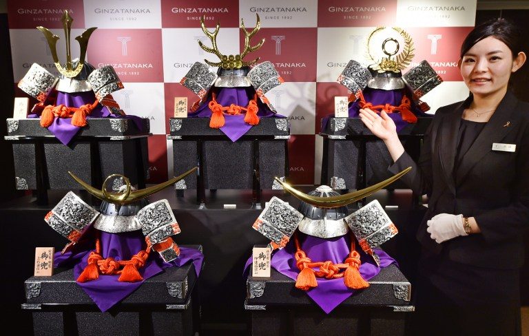Pricey gold samurai helmets on sale for Japanese boys